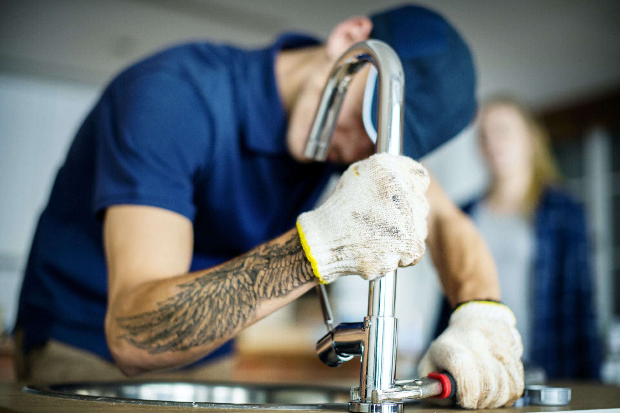 plumber-fixing-kitchen-sink-3